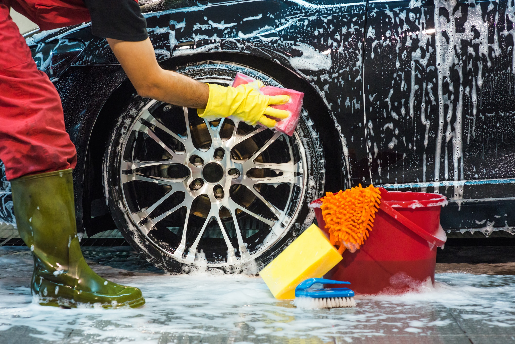 Detailed car interior cleaning focused on seats, floor mats and cabin surfaces