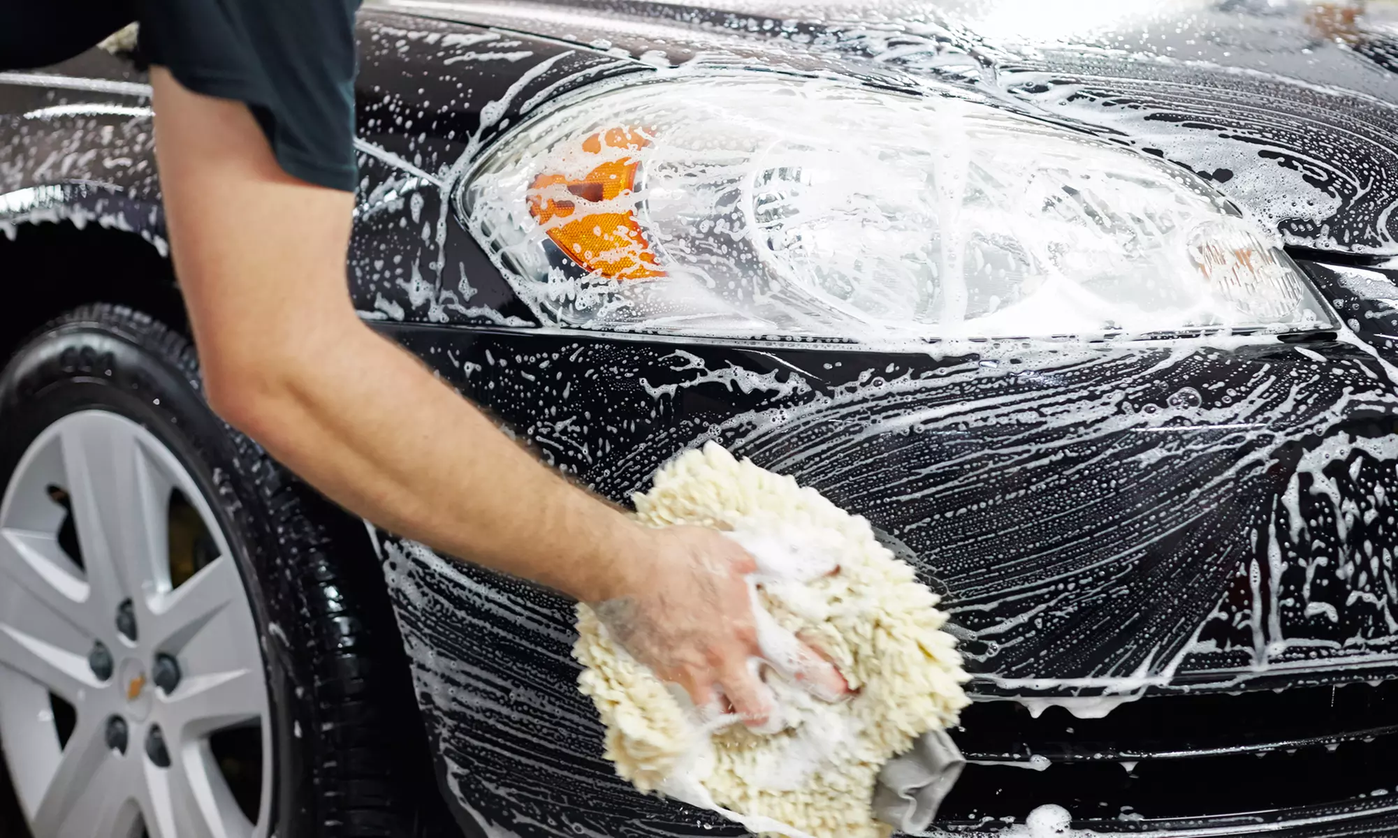 Freshly washed vehicle with clean body panels and polished exterior glass